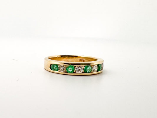14k, Yellow gold, natural  emerald and diamond channel set band.