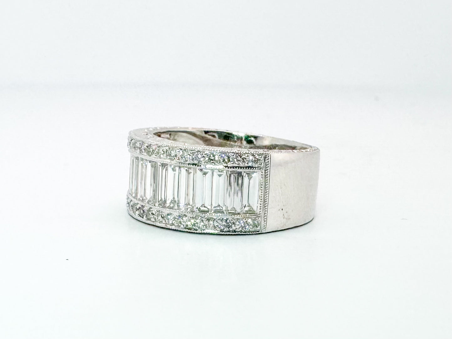 18kw Natural baguette and round brilliant diamond band 2.00 carat total weight.