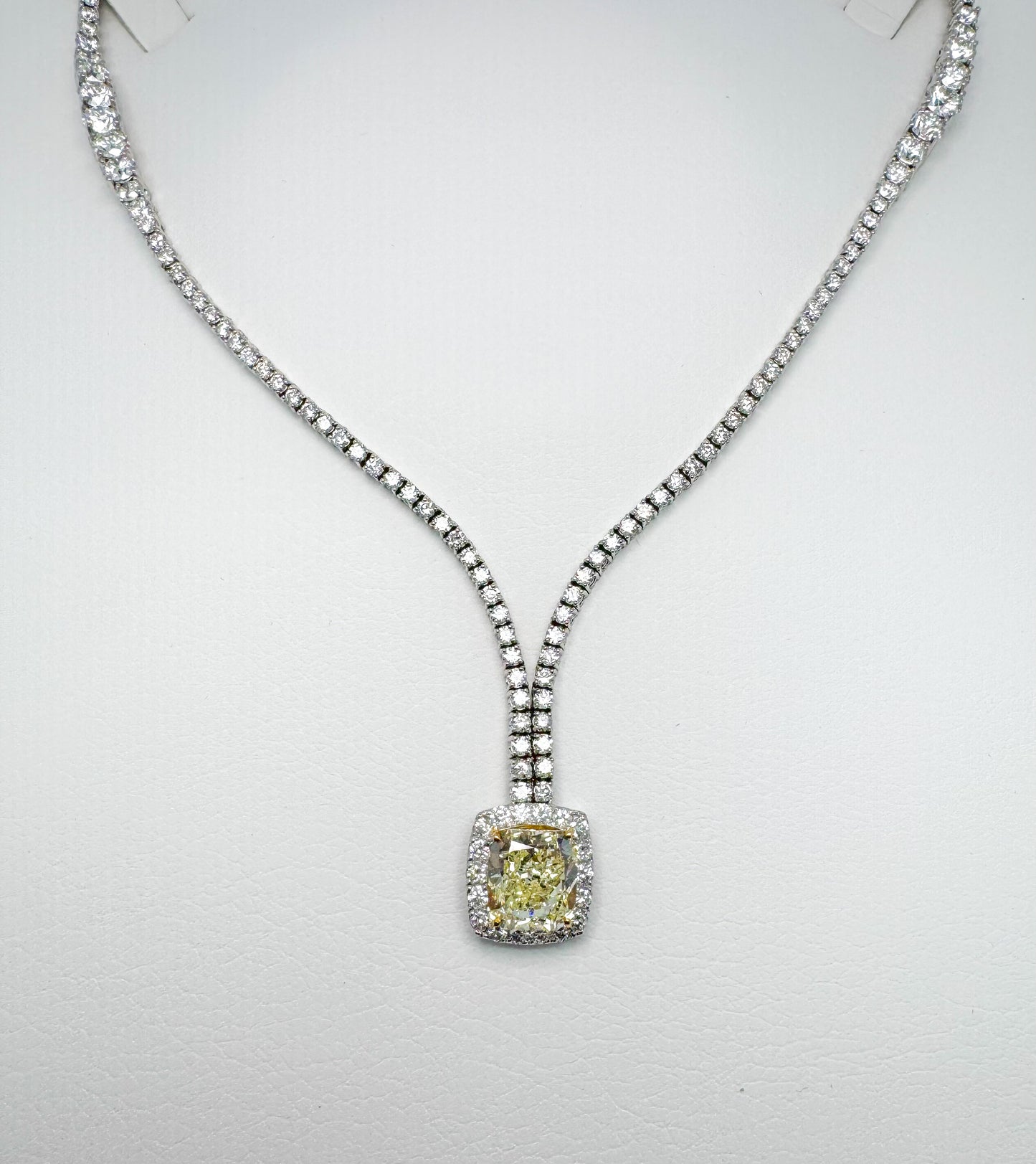 18kw tapered diamond necklace with 5.02 Natural fancy light yellow center stone GIA certified 16.39 carat total weight