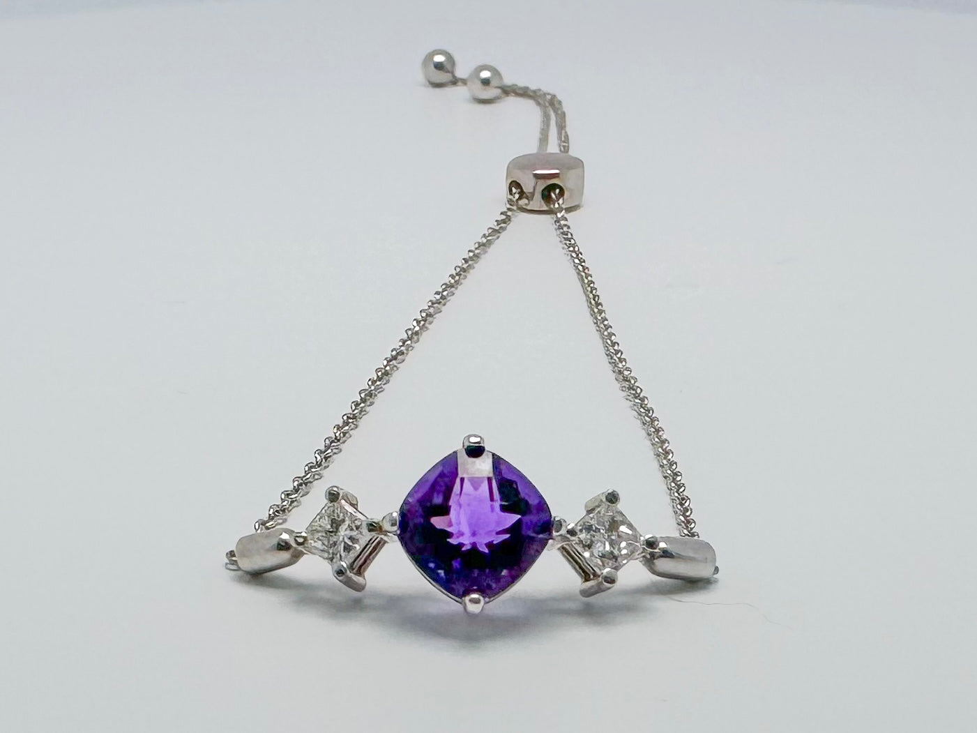 14kw Amethyst and diamond bolo style bracelet.