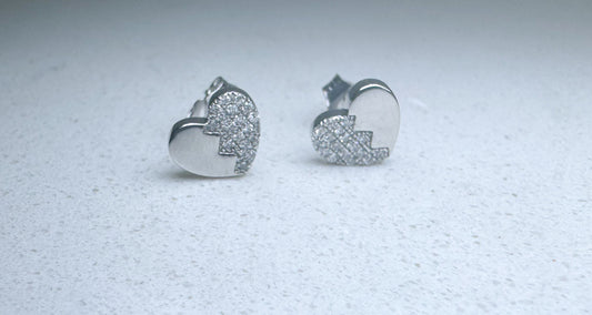 14k, white gold diamond heart shaped earrings. .15 diamond total weight