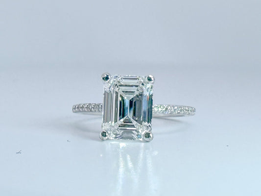 2.05 Natural VS1 E Emerald cut diamond set in classic diamond hidden halo engagemet ring. GIA certified