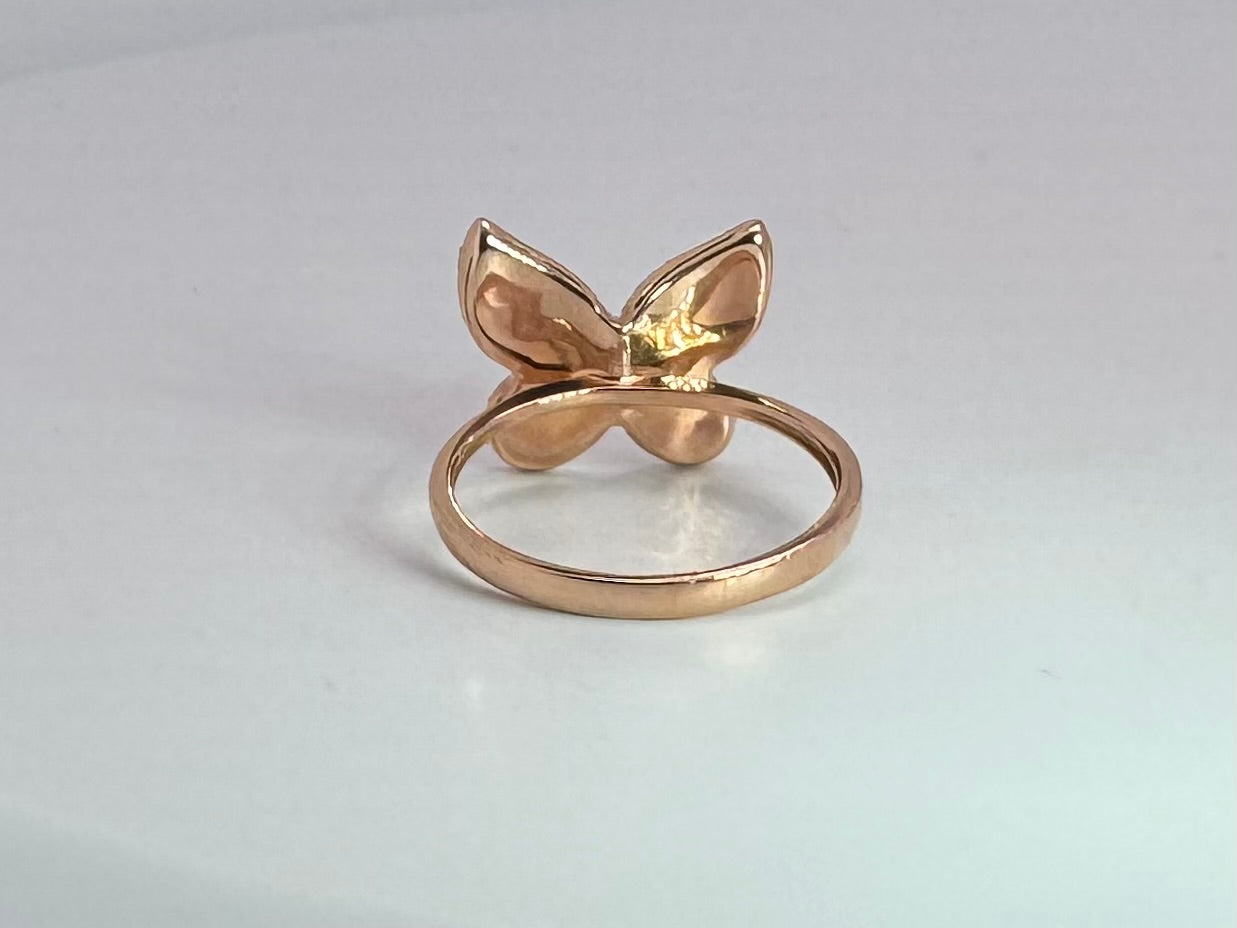 14k rose gold diamond butterfly ring with .25 dtw side diamond