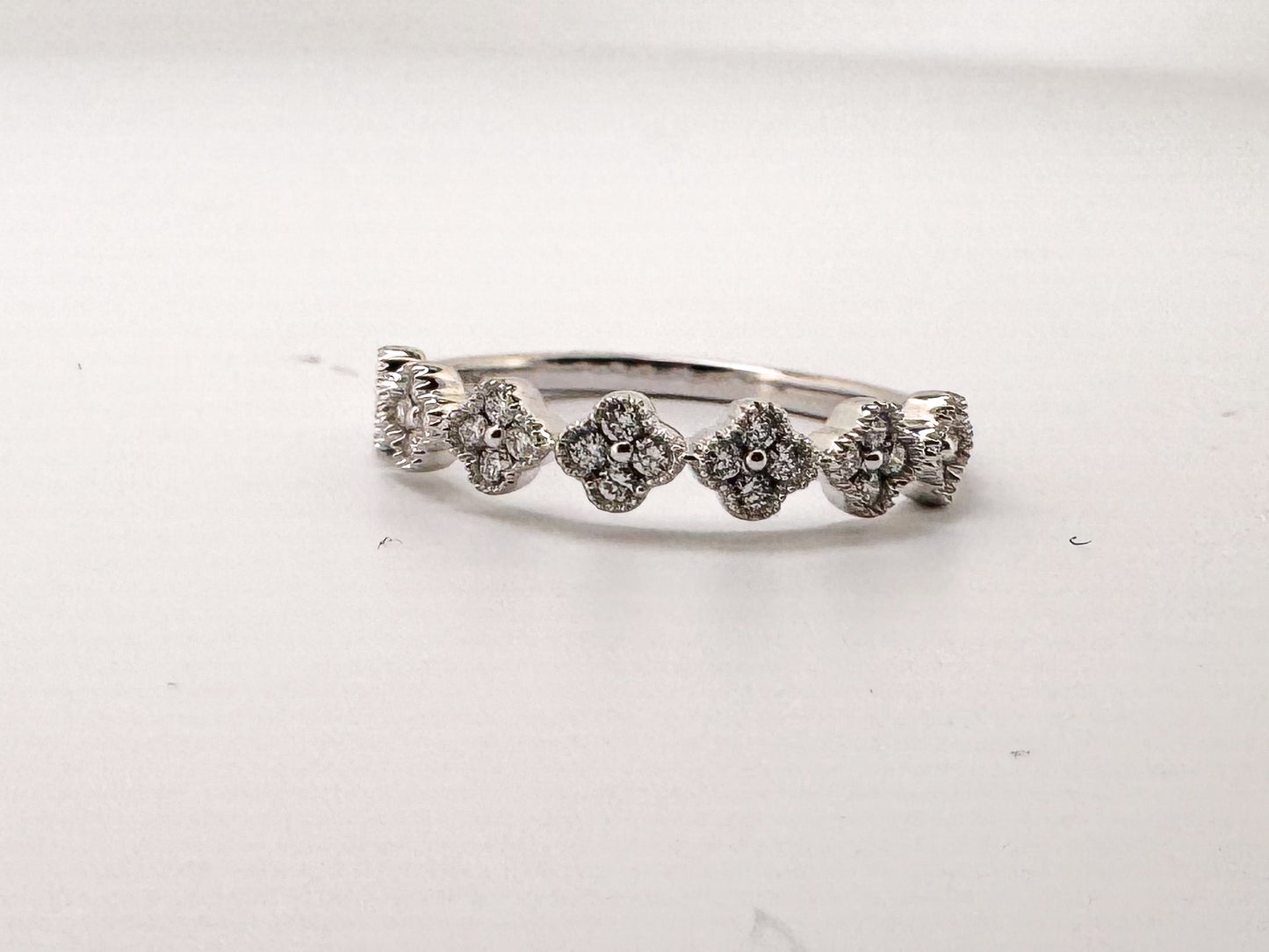 14k, White gold .25 carat total weight, clover diamond band.