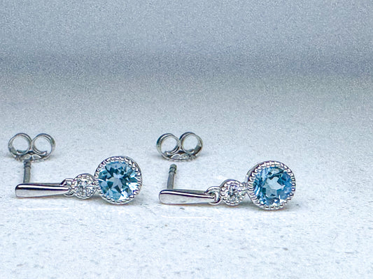 14k, white gold,  blue topaz and diamond dangle earrings.