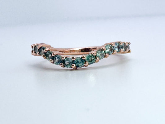 14k, rose gold, .70 ctw Montana sapphire contour band.
