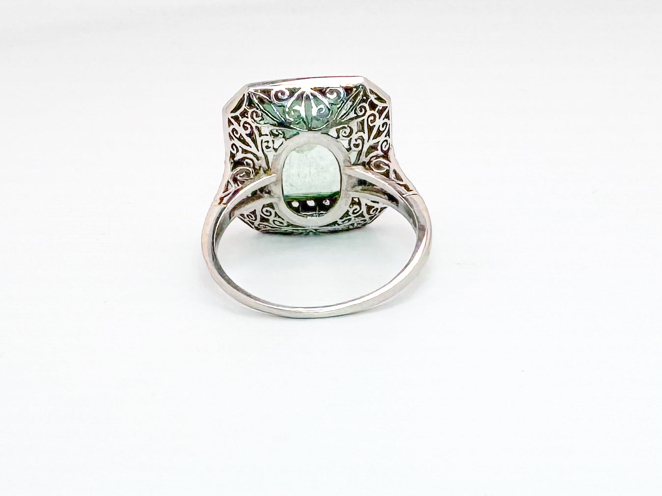 Platinum 6.50 carat, natural mint green emerald set with .85 carats of natural side diamonds. ART DECO