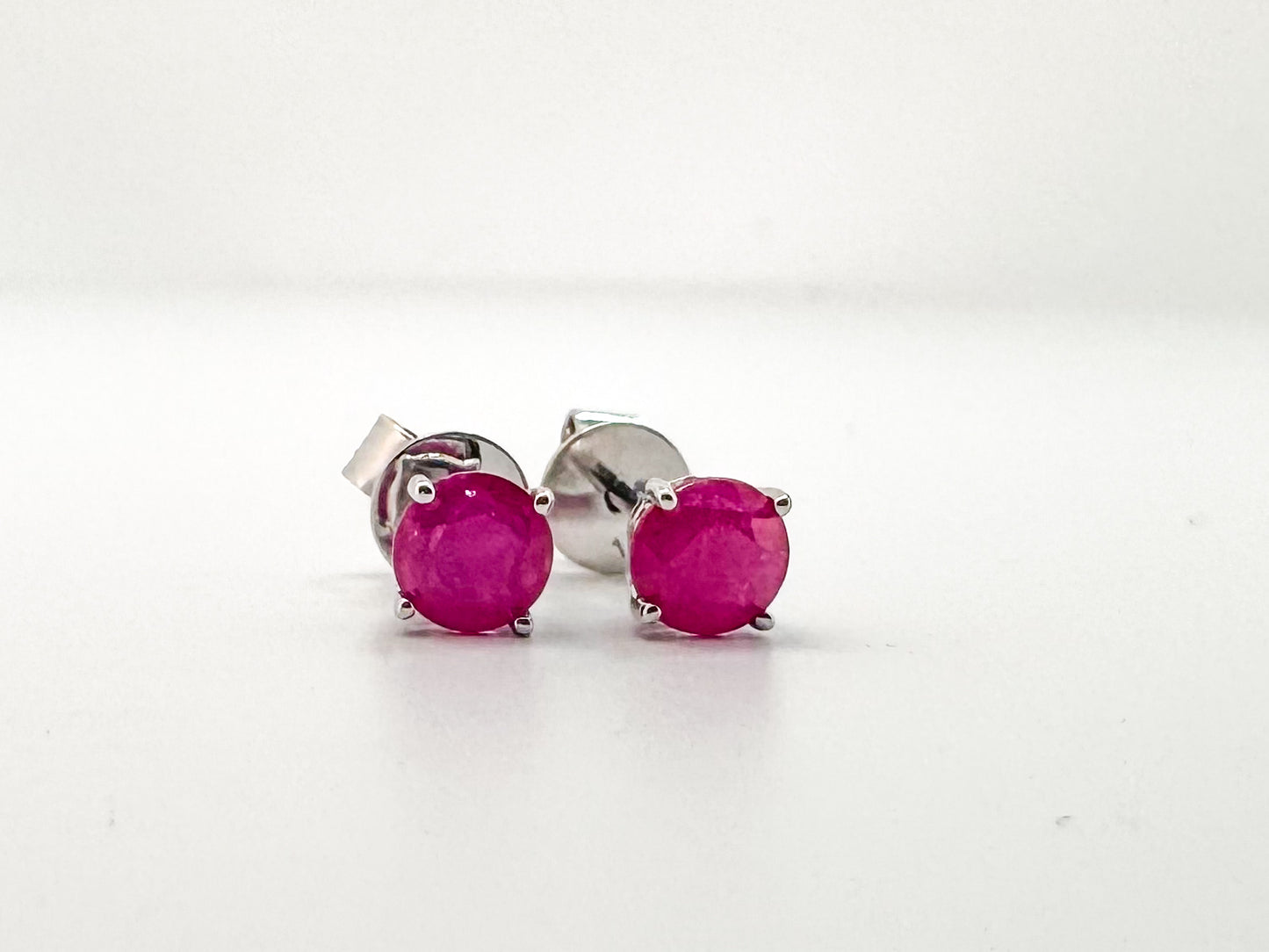 14K white gold, natural ruby stud earrings.