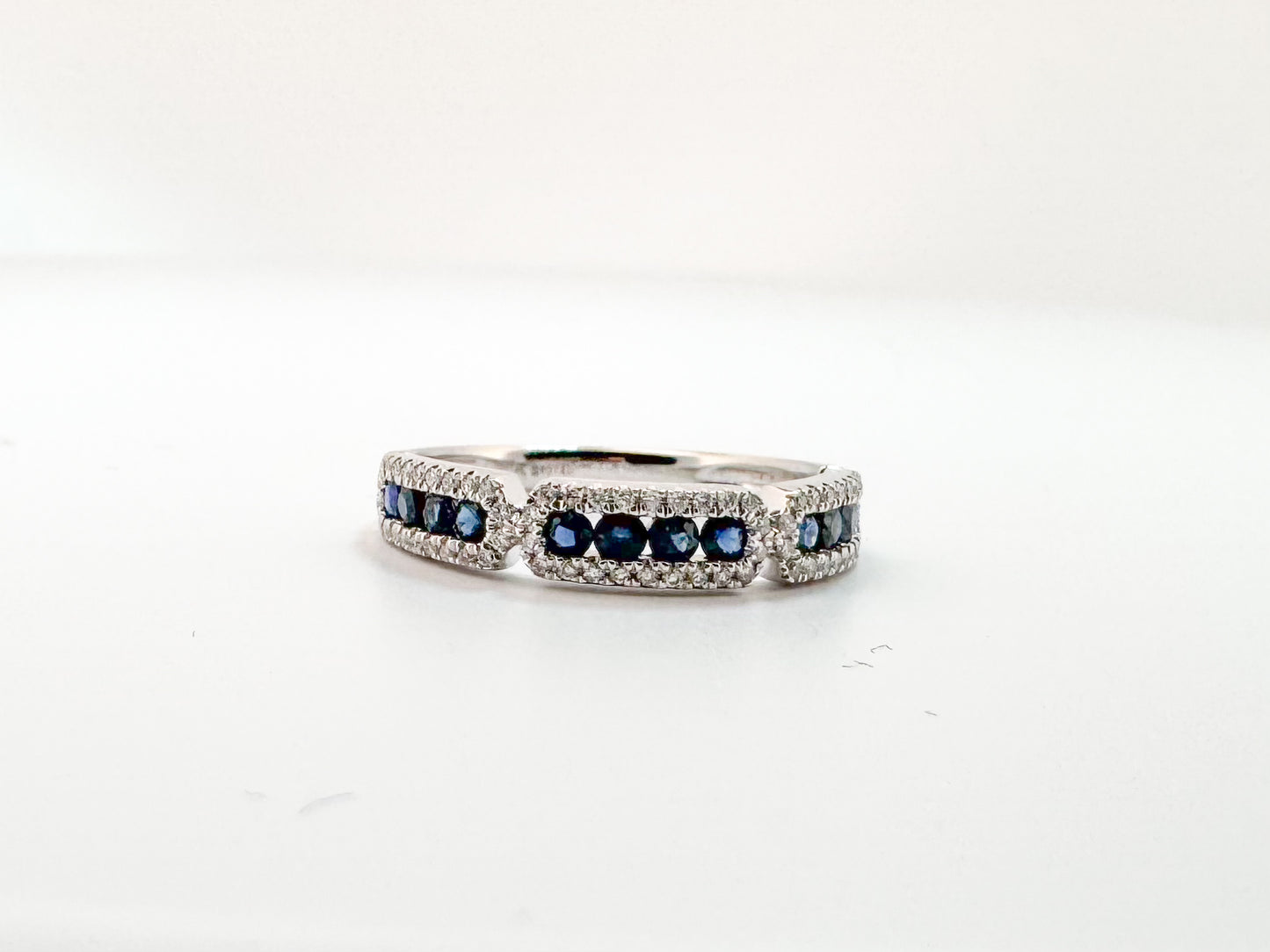 14k, White gold, .20 diamond total weight, .42 sapphire total weight.