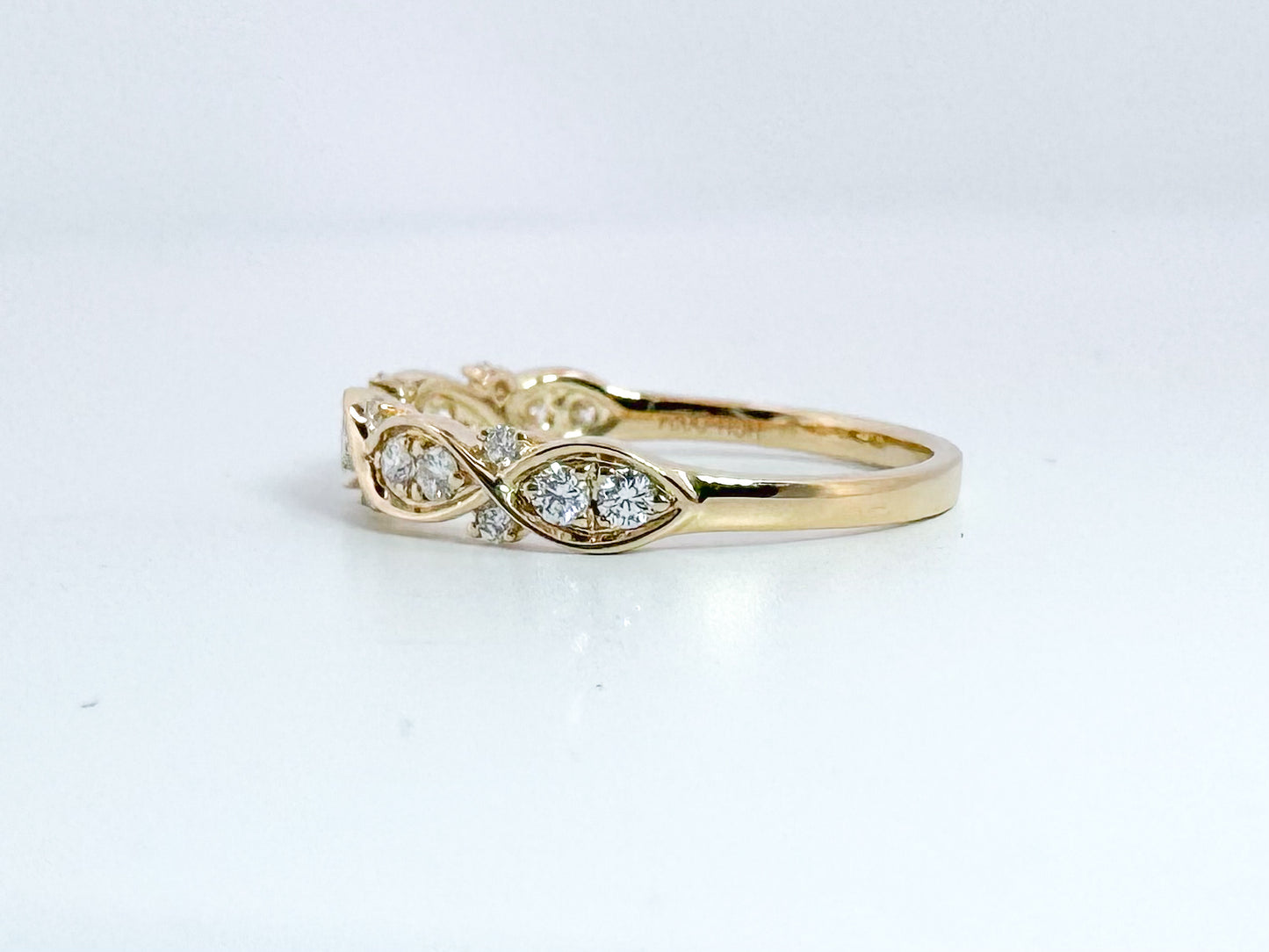 14k, Yellow gold .24 carat , diamond total weight band.