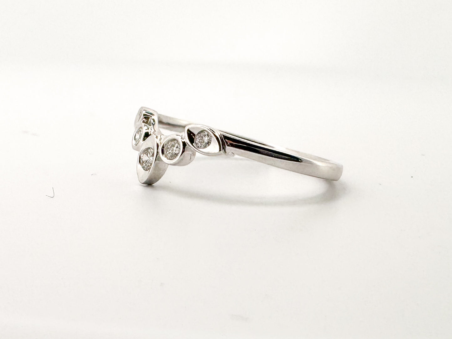 14K, White gold, .15 diamond total weight, contour band. Natura diamond
