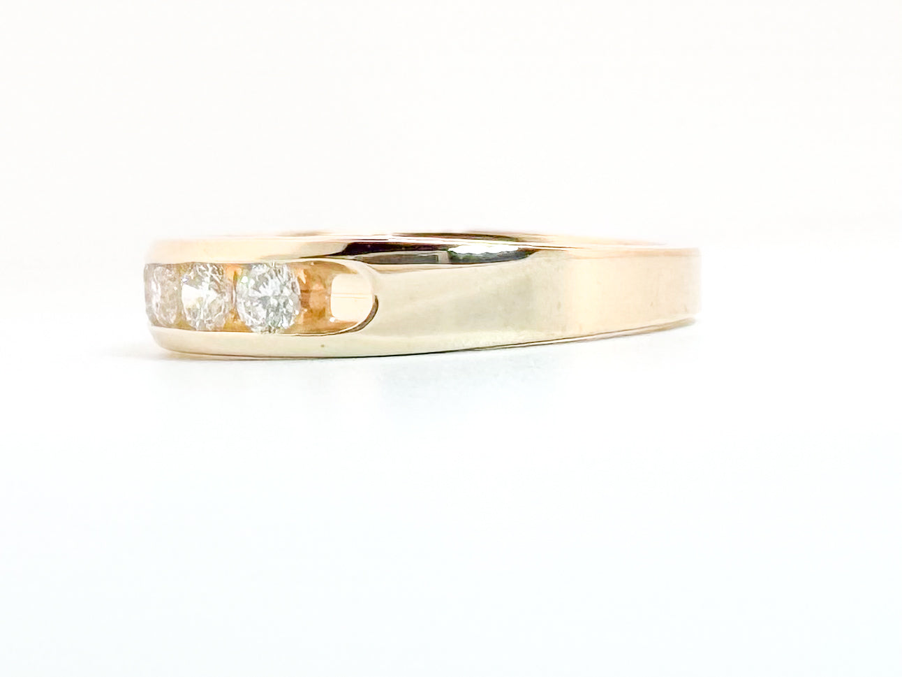 14K, yellow gold, .75 carat total weight, channel set band.