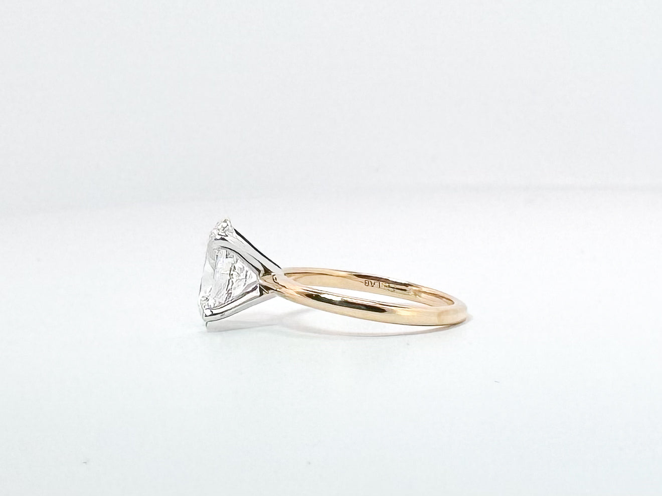 14K, 2.54 carat lab grown oval solitaire. VVS2 F IGI certified
