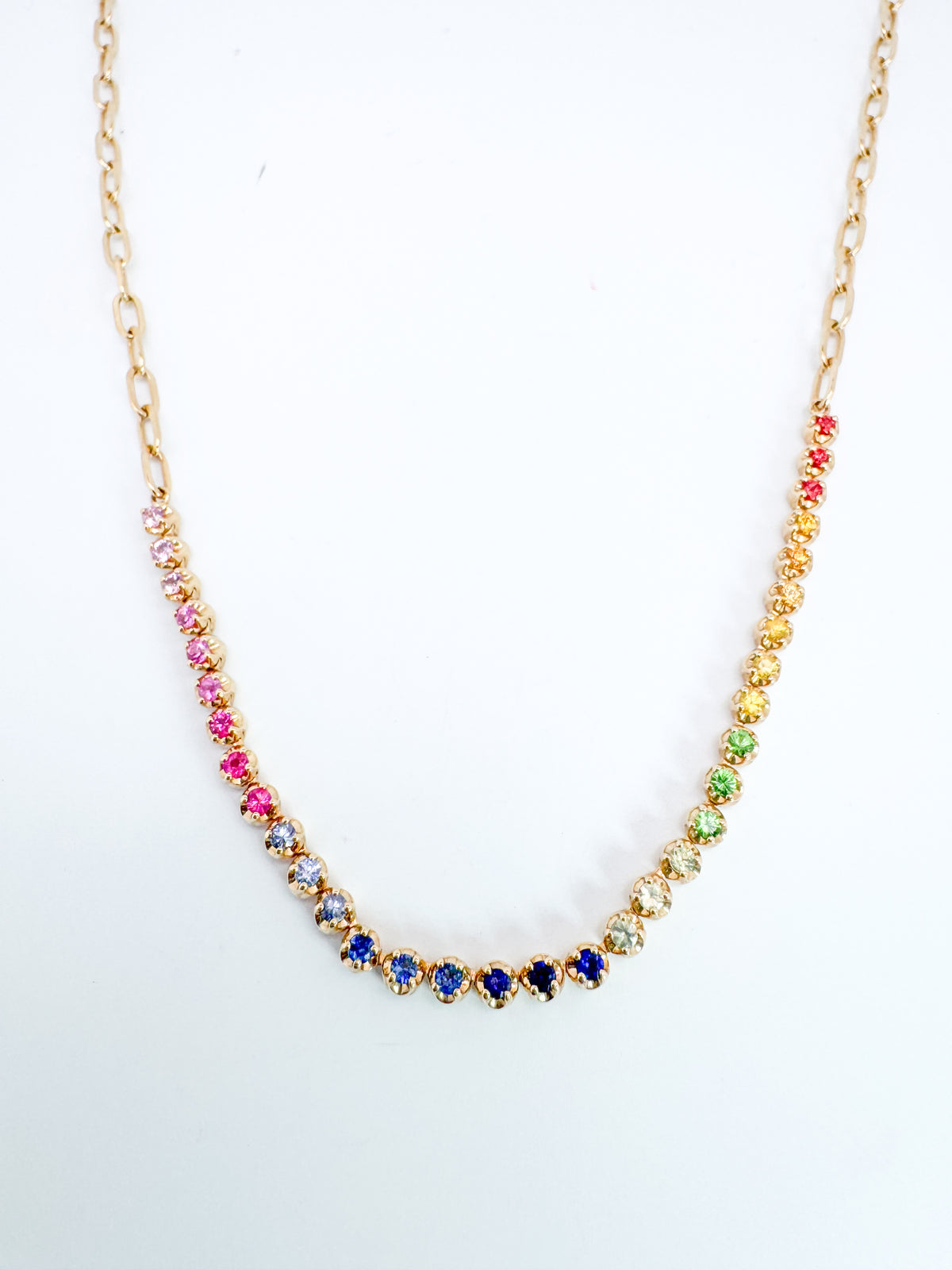 14K,Yellow gold, rainbow sapphire necklace with paperclip chain.