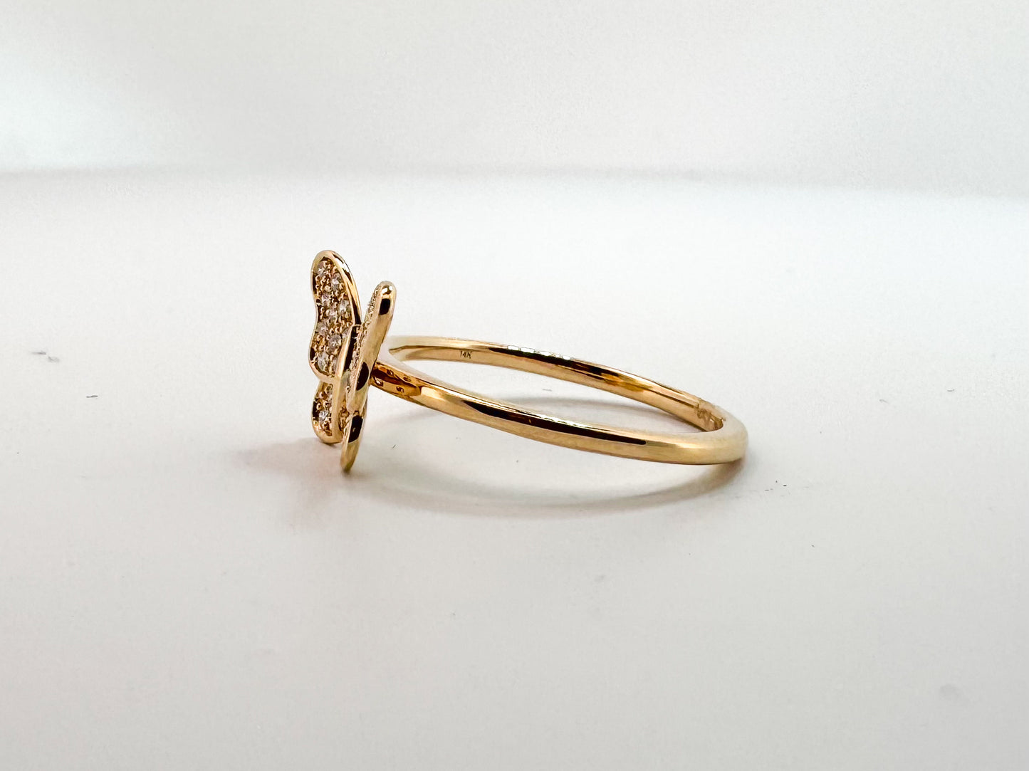 14k, Yellow gold, diamond, butterfly fashion ring. .13 carat total weight.