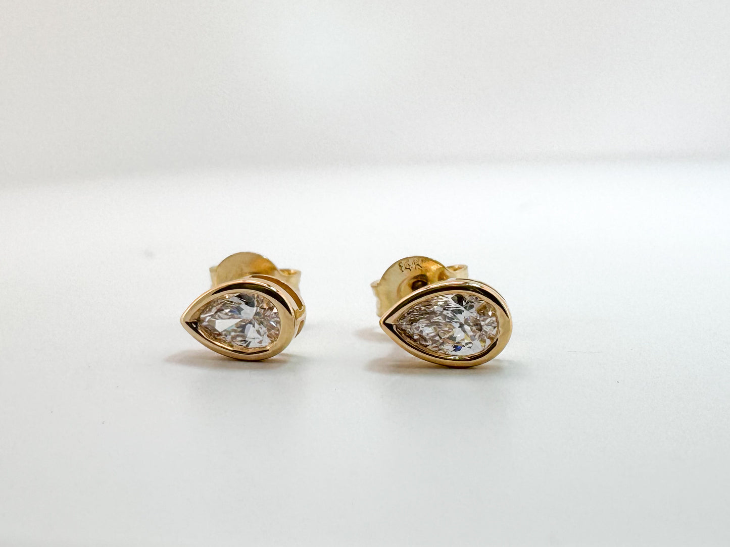 14k, yellow gold, lab grown, pear shaped,bezel set,  diamond stud earrings.