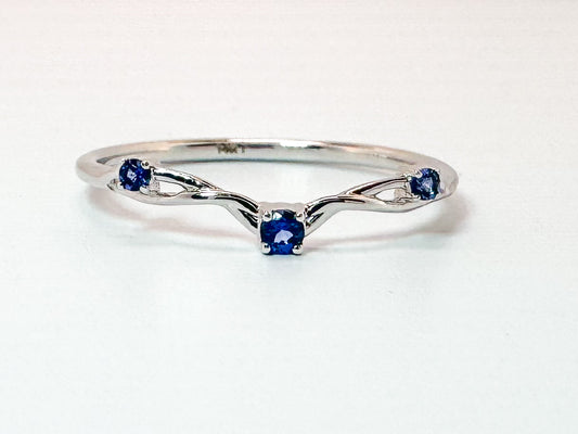 14K, white gold, .07 carat sapphire contour band.