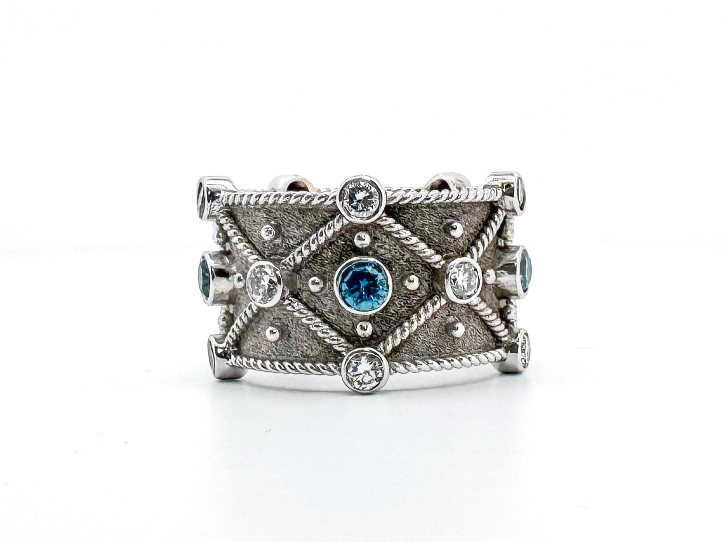 18k, White gold S. Georgios, designer ring. .48 dtw Blue diamond .81 dtw white diamond