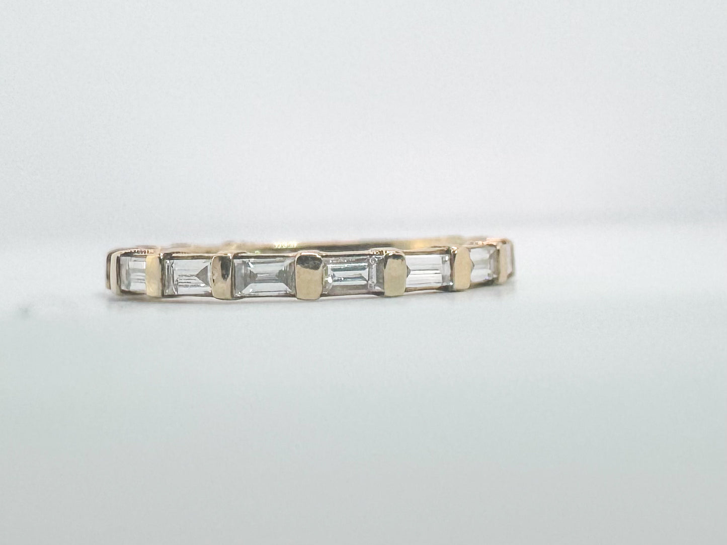 14k, yellow gold, .63 carat total weight. baguette and diamond