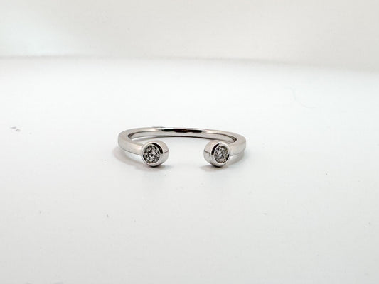 14k, white gold, open concept two diamond ring. .10 carat total weight.