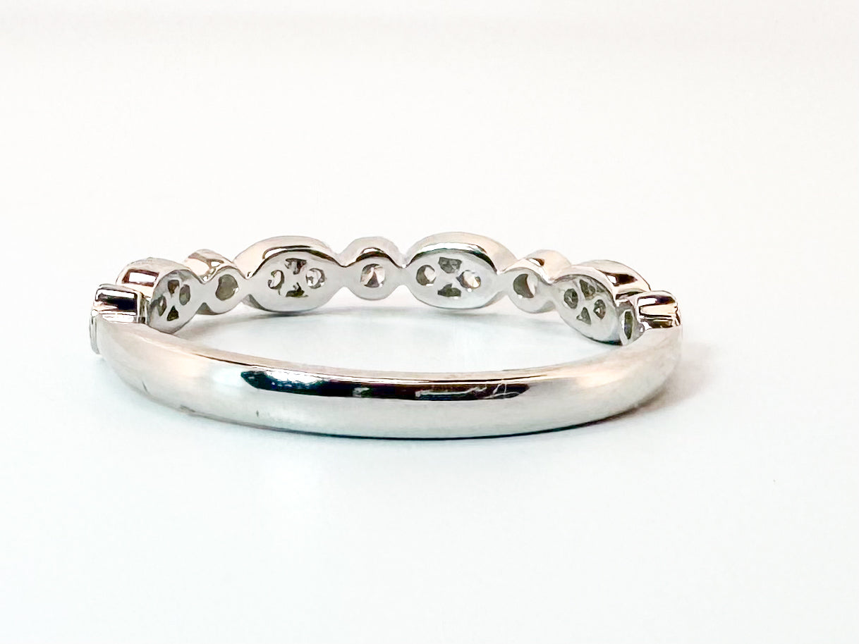 Platinum .28 diamond total weight, milgrain diamond band.