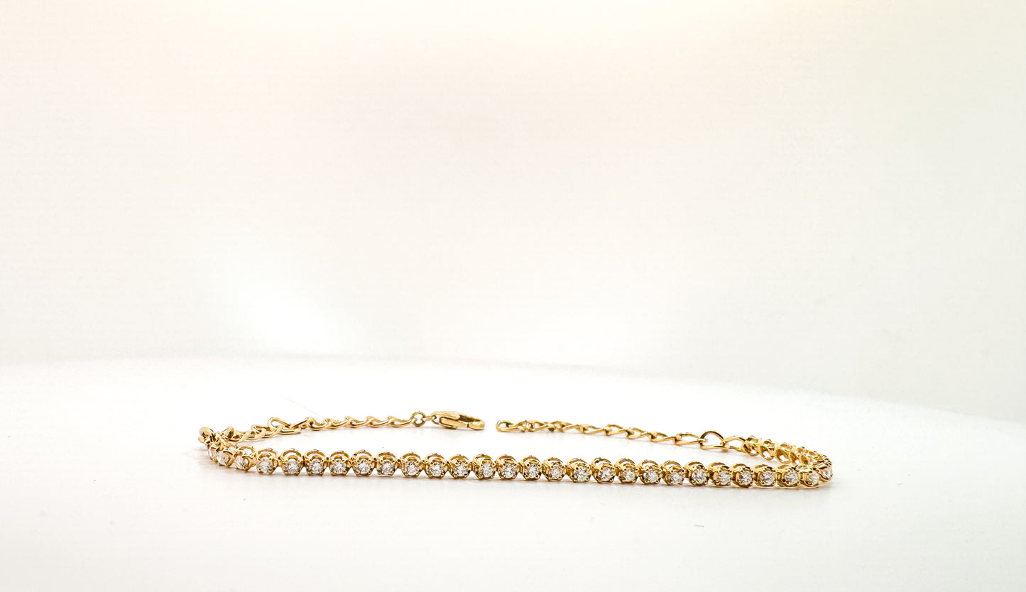 14k, Yellow gold, half way diamond tennis bracelet. .51 diamond total weight. 7.5"