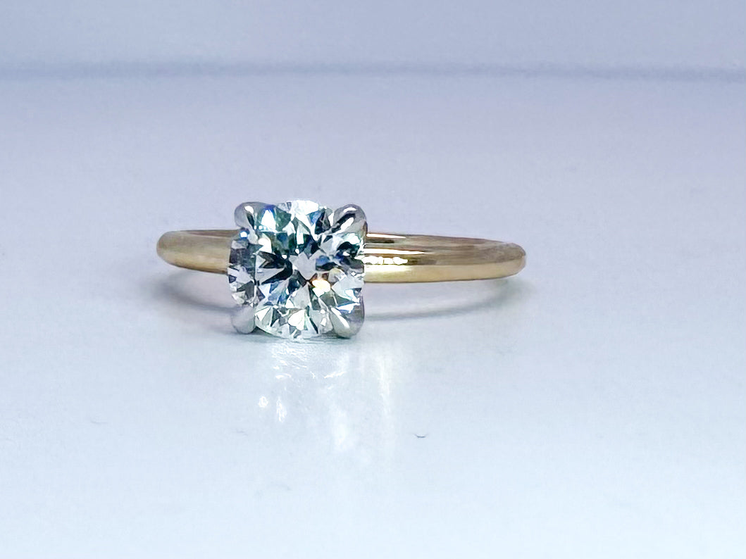 14k two tone 1.21 ideal cut round brilliant, F SI1, set in solitaire with hidden halo