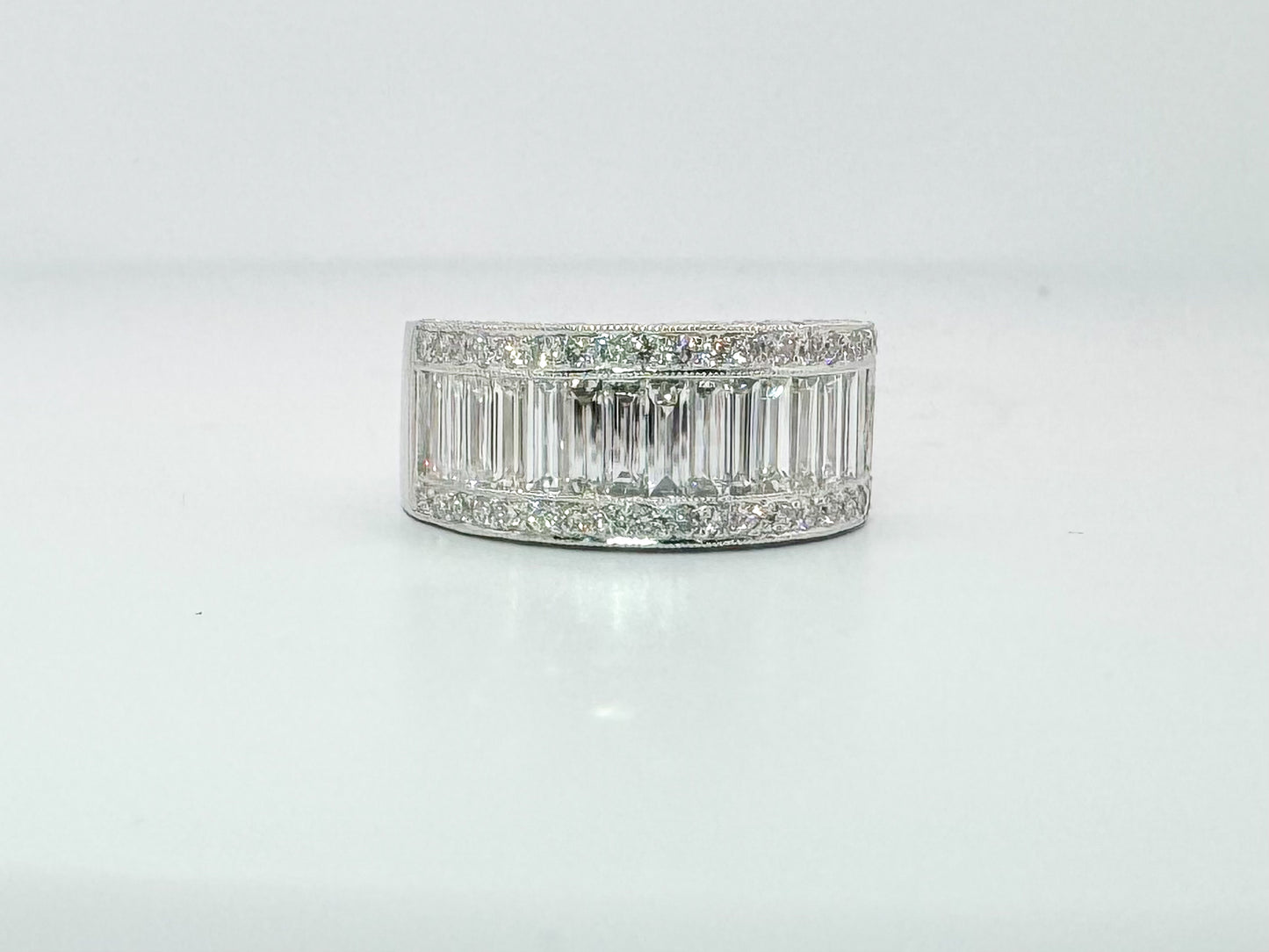 18kw Natural baguette and round brilliant diamond band 2.00 carat total weight.