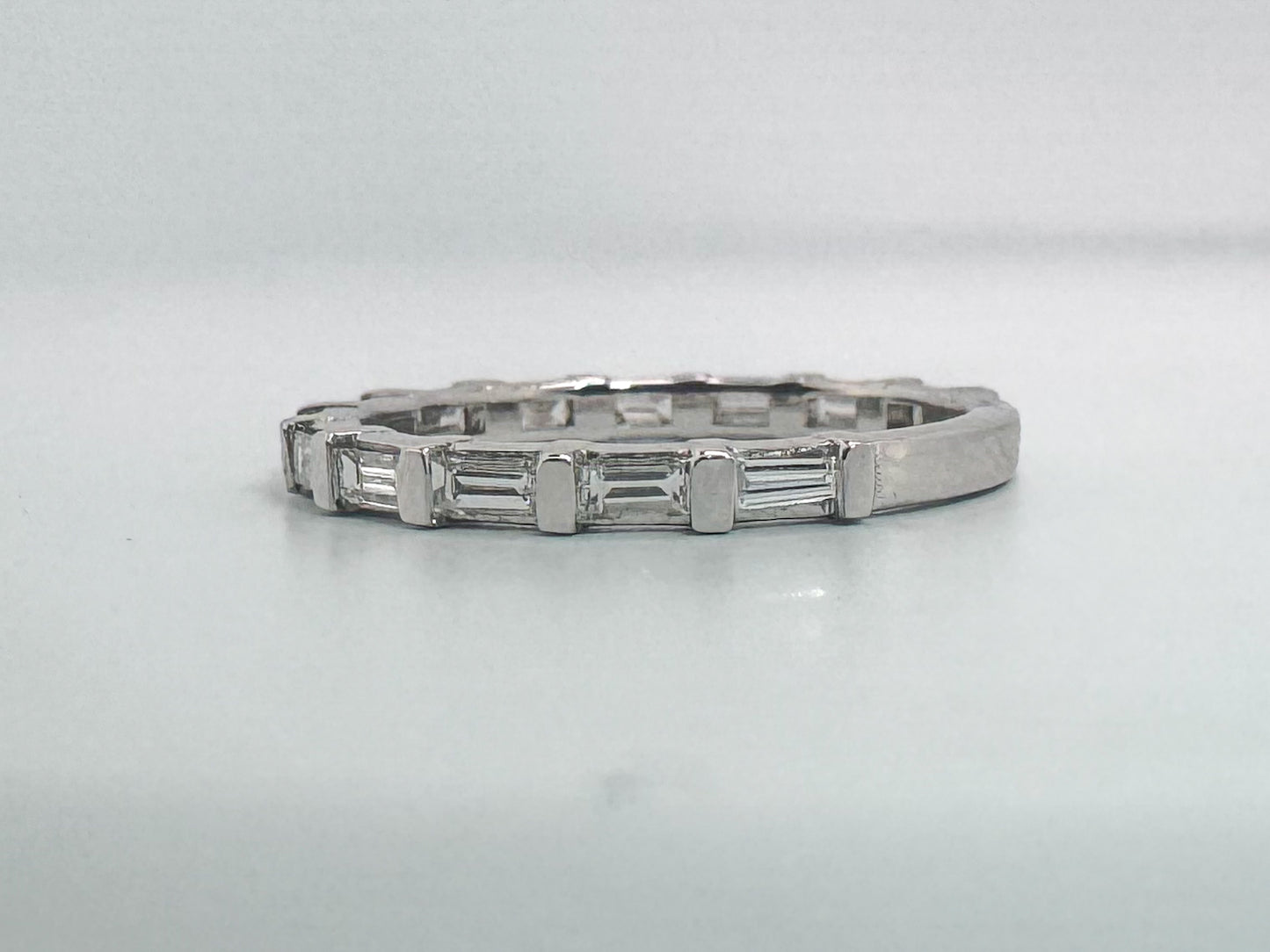 14k, White gold, .60 carats, natural baguette diamond band.