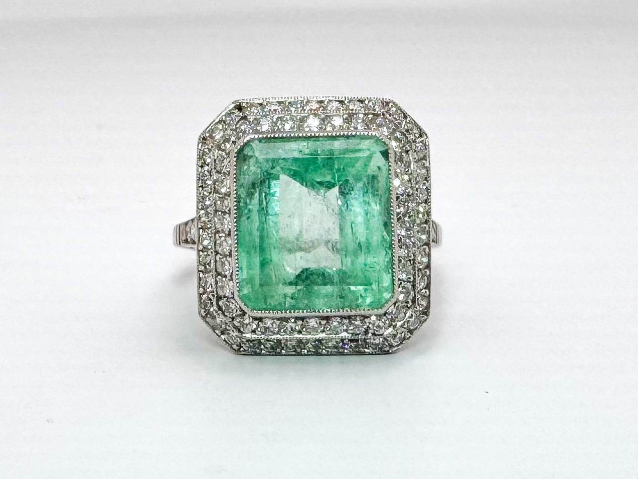 Platinum 6.50 carat, natural mint green emerald set with .85 carats of natural side diamonds. ART DECO