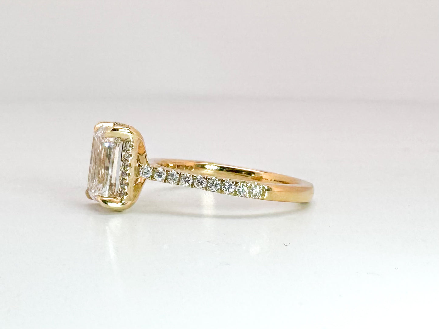 14K, yellow gold 1.78 VS1 G Emerald cut set with .22 side diamonds. Lab grown, IGI Certification